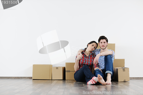 Image of Young couple moving in new house