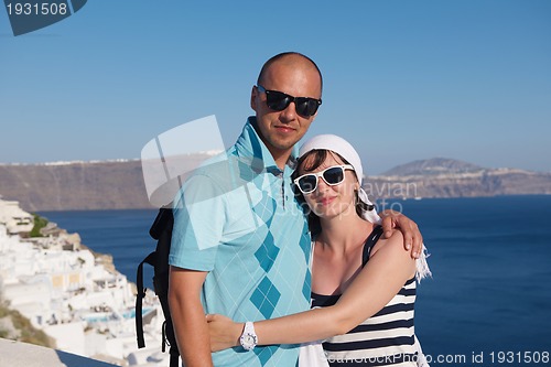 Image of happy young couple tourists in greece