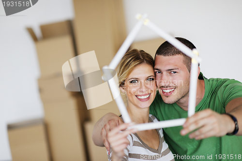 Image of Young couple moving in new house