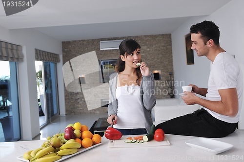 Image of young couple have fun in modern kitchen