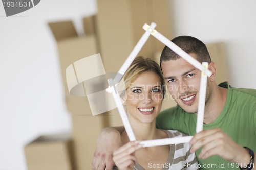 Image of Young couple moving in new home