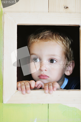 Image of happy child in a window