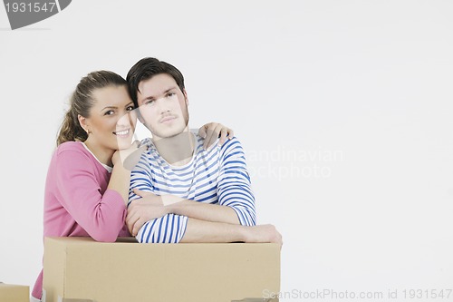 Image of Young couple moving in new home