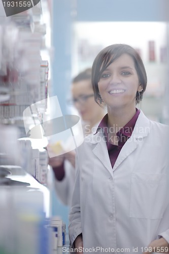 Image of team of pharmacist chemist woman  in pharmacy drugstore