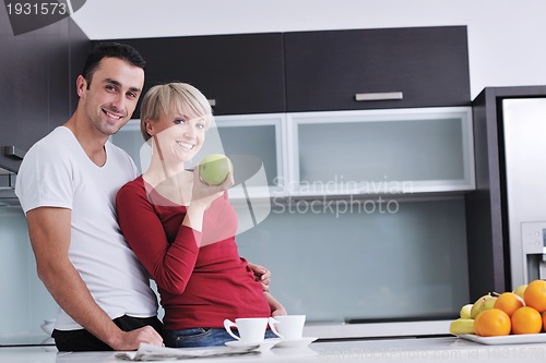Image of young couple have fun in modern kitchen