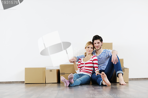 Image of Young couple moving in new house