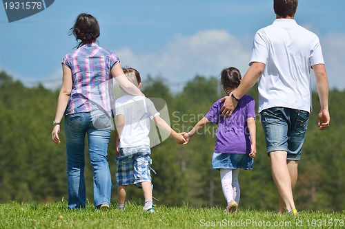 Image of happy young family have fun outdoors