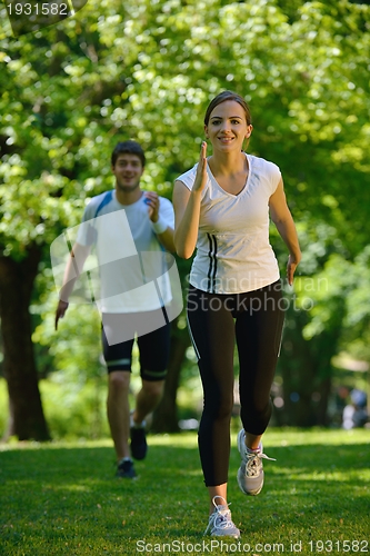 Image of Young couple jogging