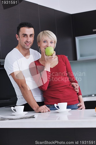 Image of young couple have fun in modern kitchen