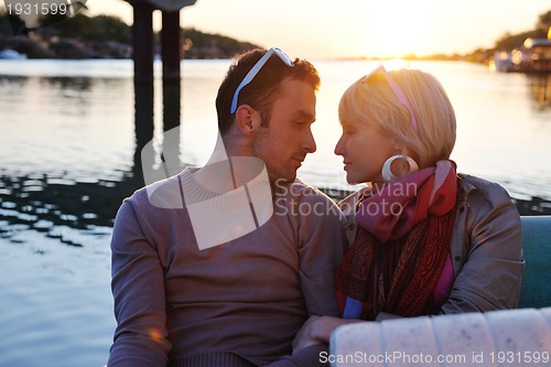 Image of couple in love  have romantic time on boat