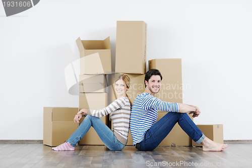 Image of Young couple moving in new house