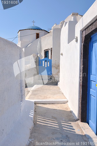 Image of Greek woman on the streets of Oia, Santorini, Greece