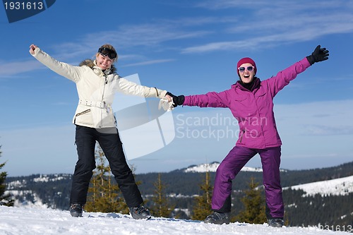 Image of winter season fun with group of girls