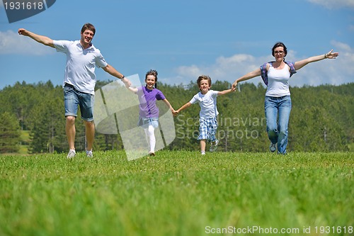 Image of happy young family have fun outdoors