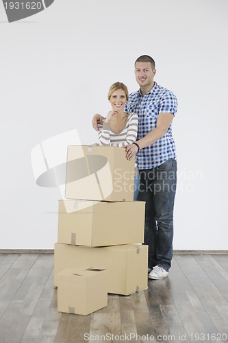 Image of Young couple moving in new home