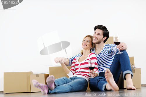 Image of Young couple moving in new house