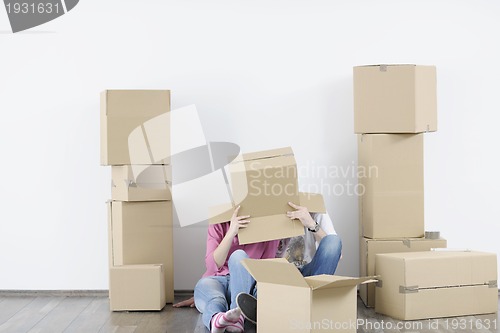 Image of Young couple moving in new home