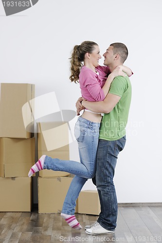 Image of Young couple moving in new home