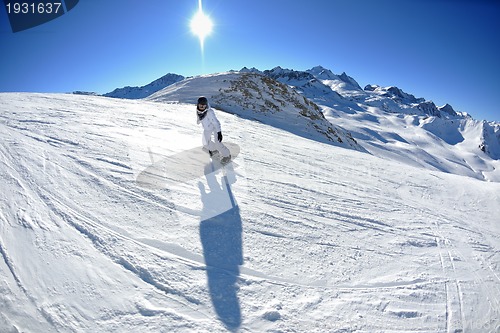 Image of skiing on fresh snow at winter season at beautiful sunny day