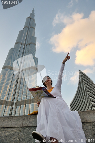 Image of happy tourist woman