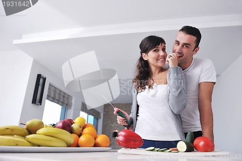 Image of young couple have fun in modern kitchen