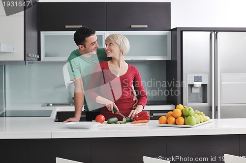 Image of young couple have fun in modern kitchen