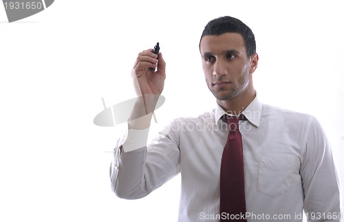 Image of business man draw with marker on empty space