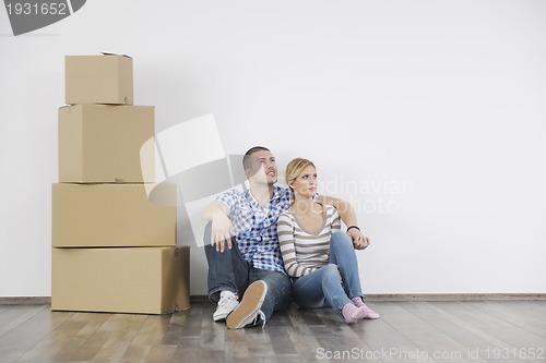 Image of Young couple moving in new home