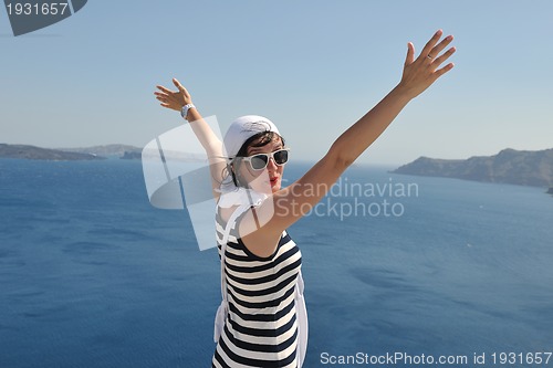 Image of Greek woman on the streets of Oia, Santorini, Greece