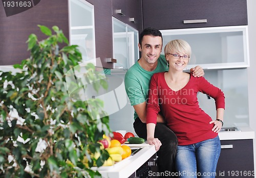 Image of young couple have fun in modern kitchen