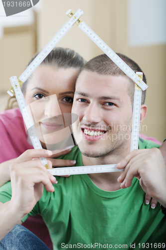 Image of Young couple moving in new house