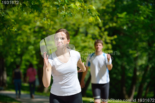 Image of Young couple jogging