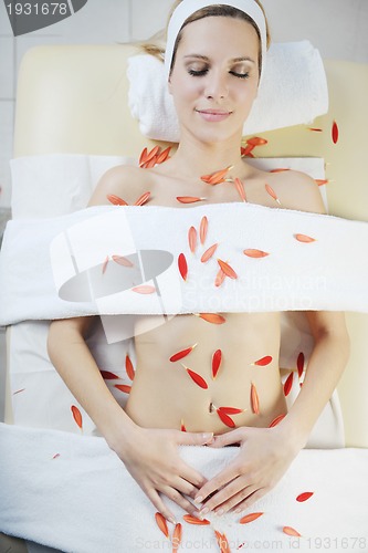 Image of Beautiful young woman in spa