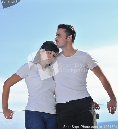 Image of couple relaxing on balcony