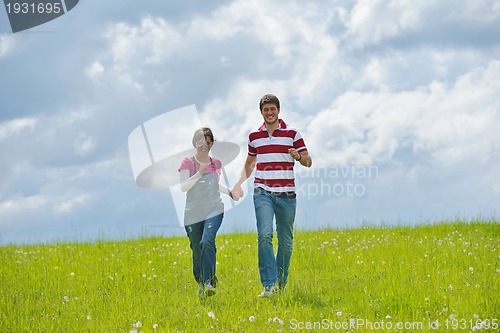 Image of romantic young couple in love together outdoor