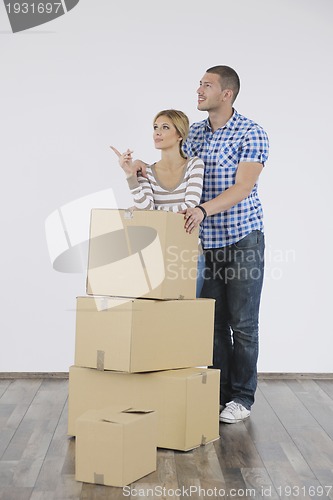 Image of Young couple moving in new home