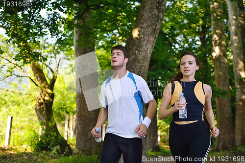 Image of Young couple jogging