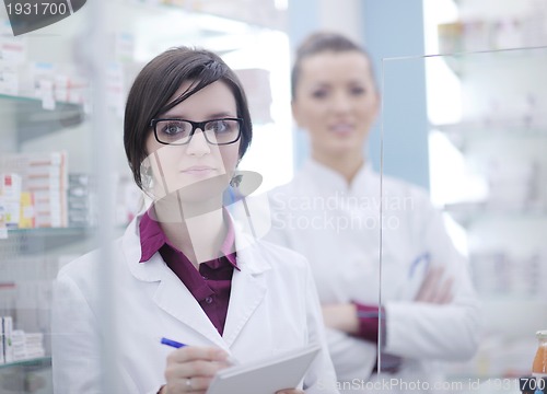 Image of team of pharmacist chemist woman  in pharmacy drugstore