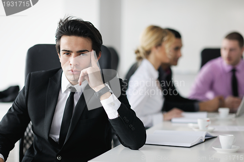 Image of young business man at meeting