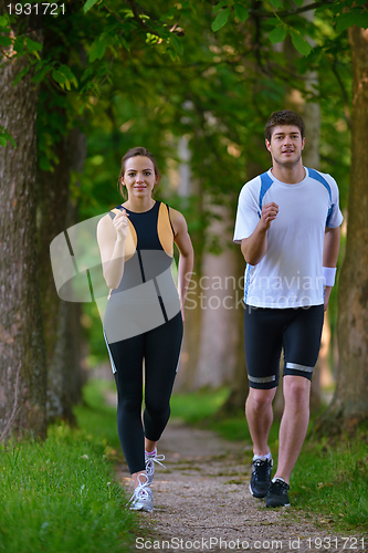 Image of Young couple jogging