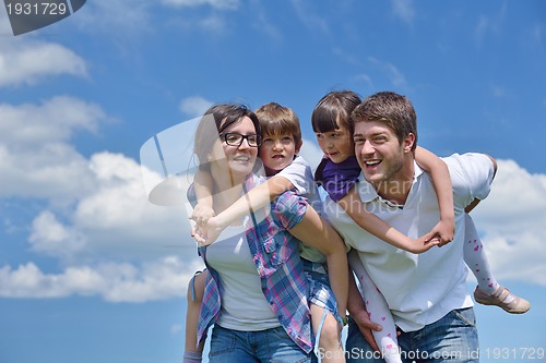 Image of happy young family have fun outdoors
