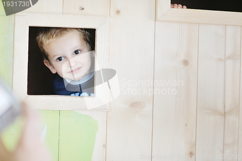 Image of happy child in a window