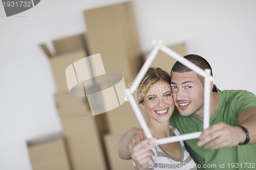 Image of Young couple moving in new home