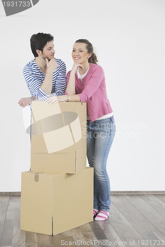 Image of Young couple moving in new home