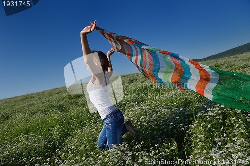 Image of young woman in wheat field at summer