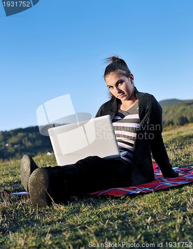 Image of young teen girl work on laptop outdoor