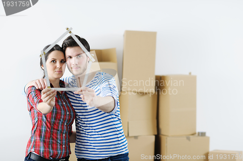 Image of Young couple moving in new house