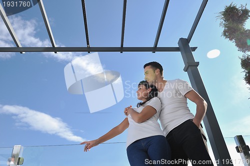 Image of couple relaxing on balcony