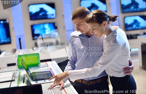 Image of people buy  in consumer electronics store