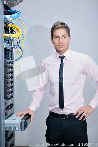 Image of young it engineer in datacenter server room